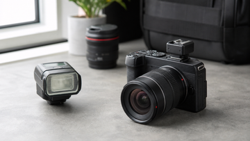 Canon EOS R camera setup with Multi-Function Shoe adapter and flash accessory on a studio desk