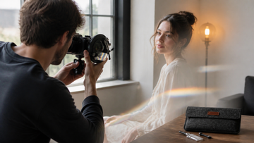 Portrait photographer creating an in-camera reflection with a Lensbaby OMNI filter system