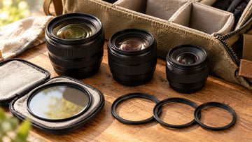 Travel camera bag with multiple lenses, one filter and open step-up rings; generated illustration