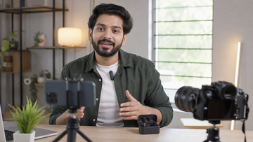 Creator recording YouTube video with compact wireless lavalier microphone phone and camera